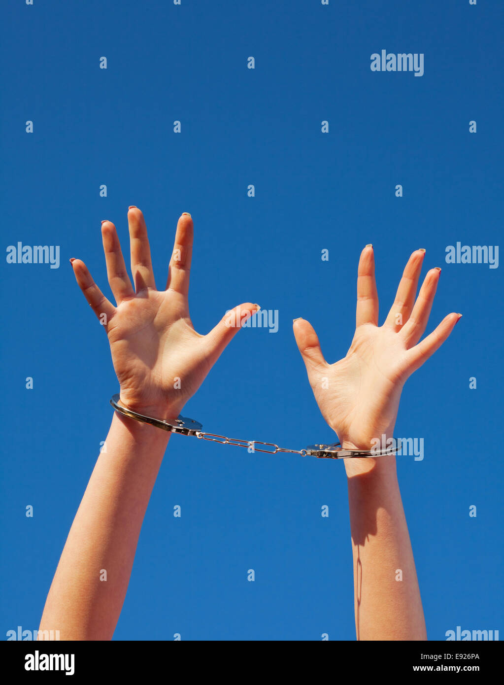 Handcuffed woman's hands Stock Photo Alamy