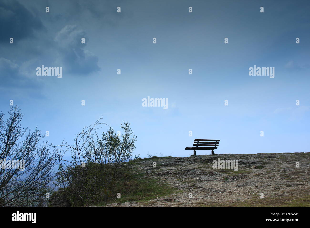 bench on a lonely cliff Stock Photo