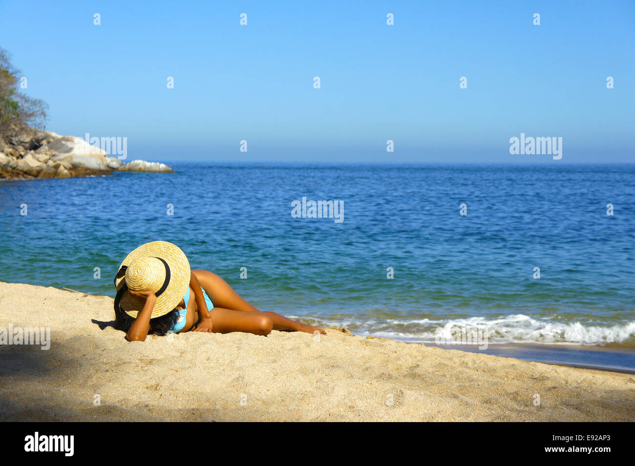 Woman lying on the beach Stock Photo