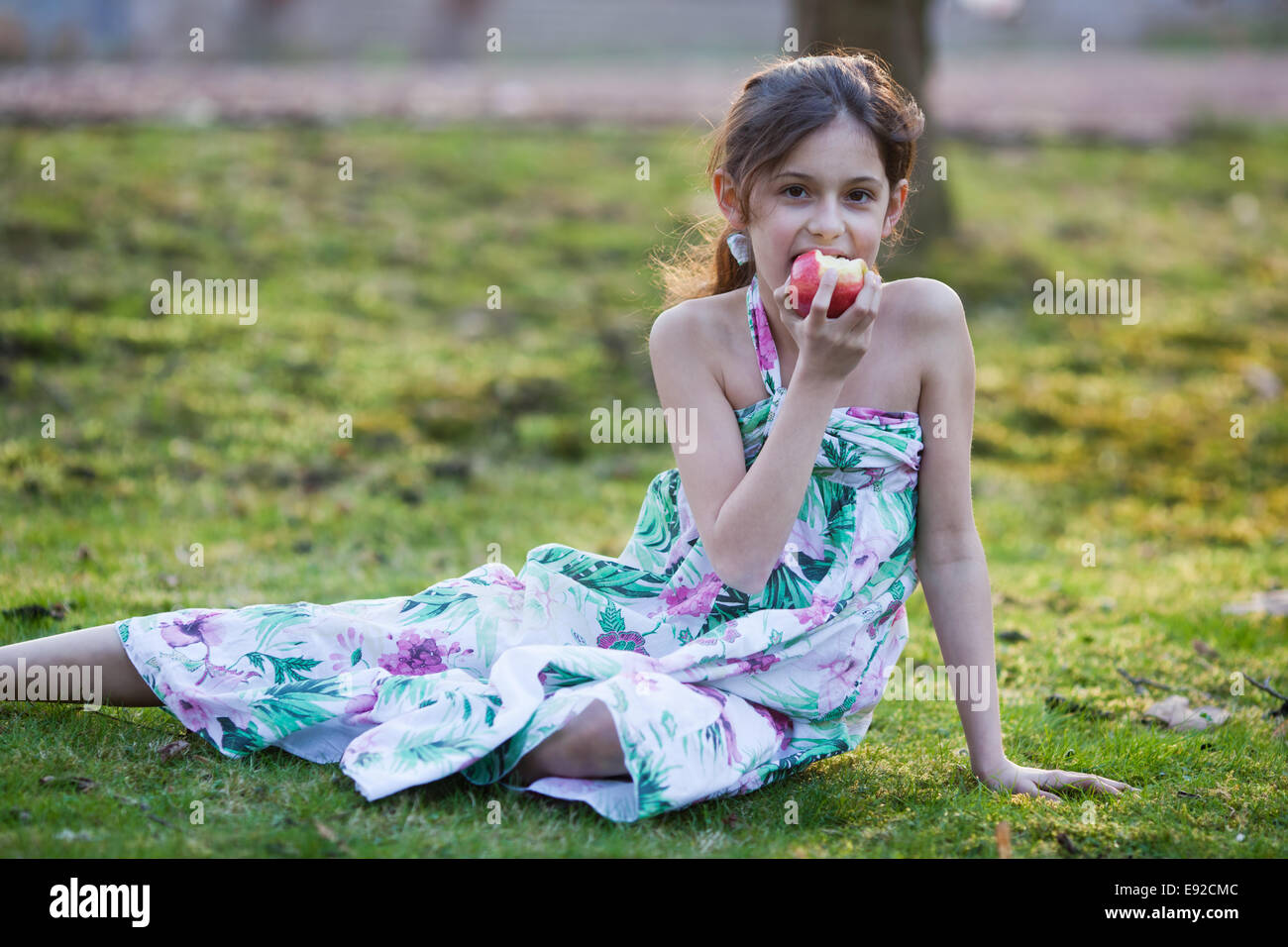 girl eats an apple Stock Photo