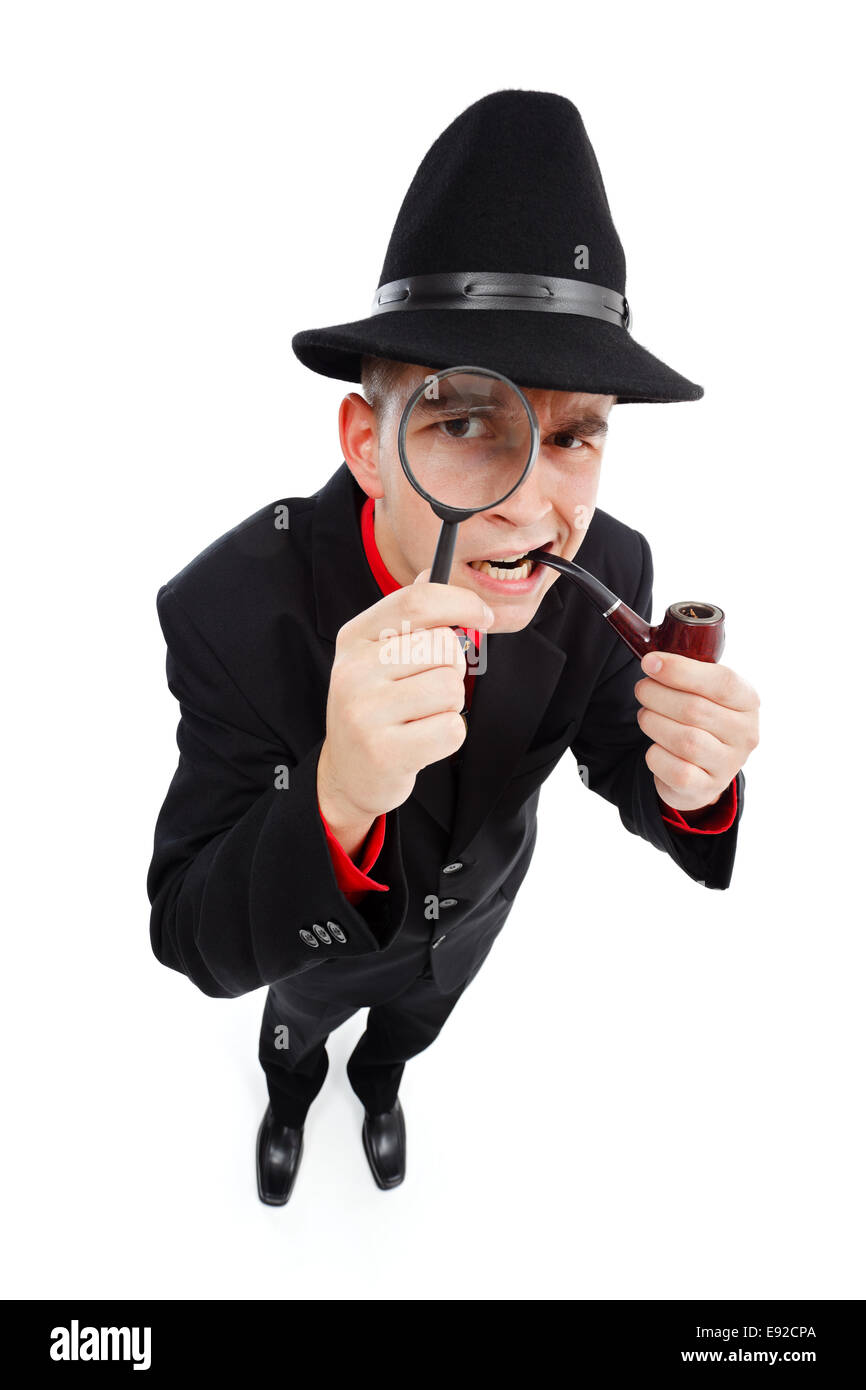 Skeptical detective with pipe in his mouth looking up through magnifying  glass Stock Photo - Alamy
