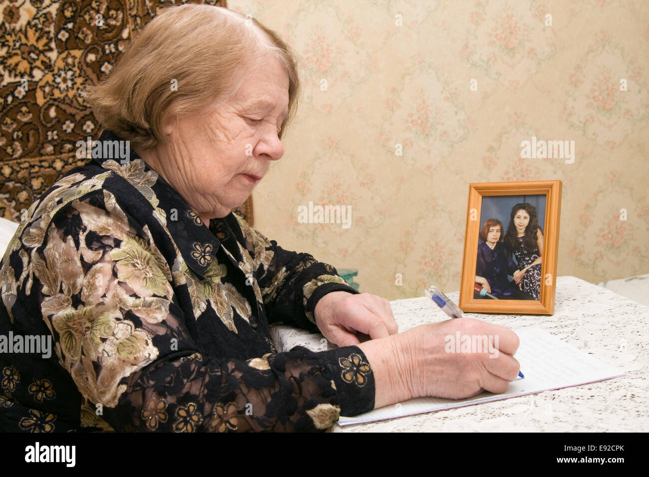 Elderly woman writing letter hi-res stock photography and images - Alamy