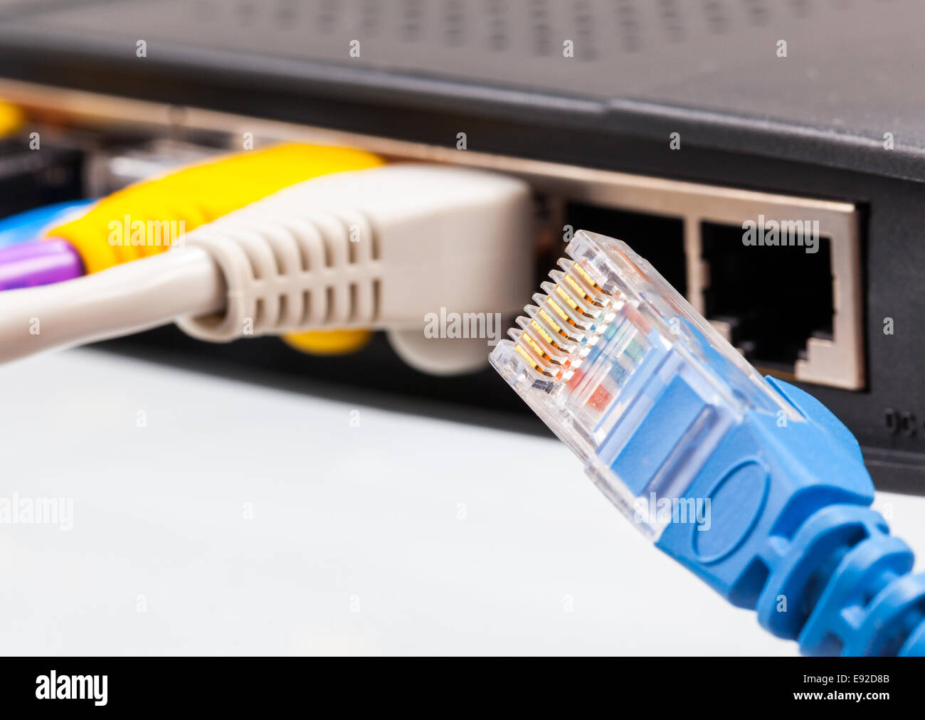Cat 5 cables in multiple colors in router Stock Photo Alamy