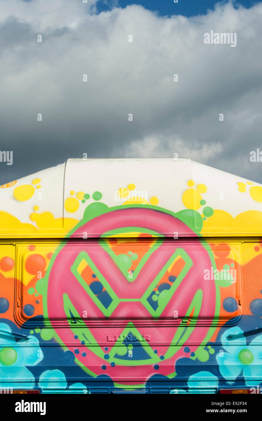 VW Symbol spray painted in bright colours on the back of a caravan Stock Photo