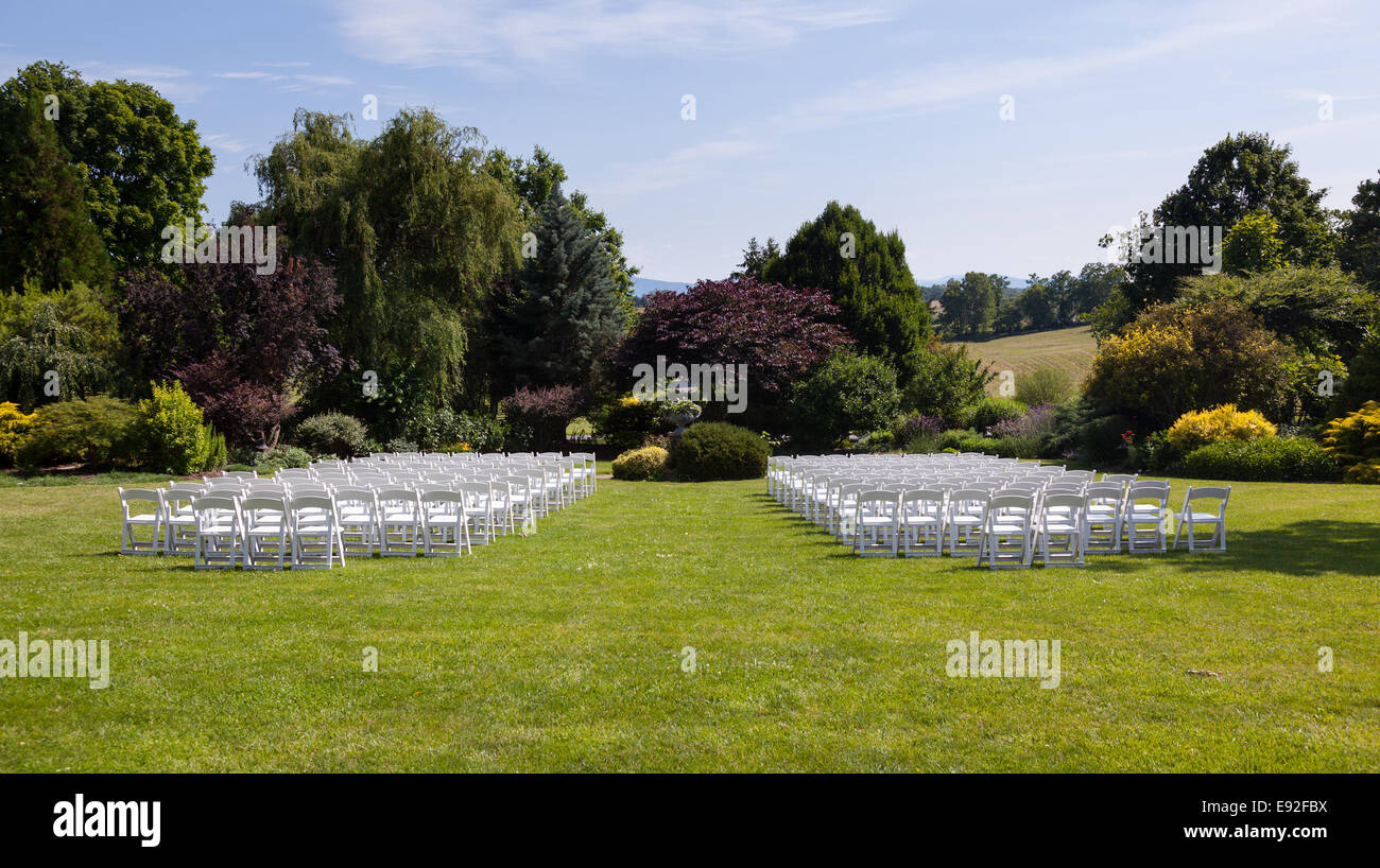 Rows of wooden chairs set up for wedding Stock Photo Alamy