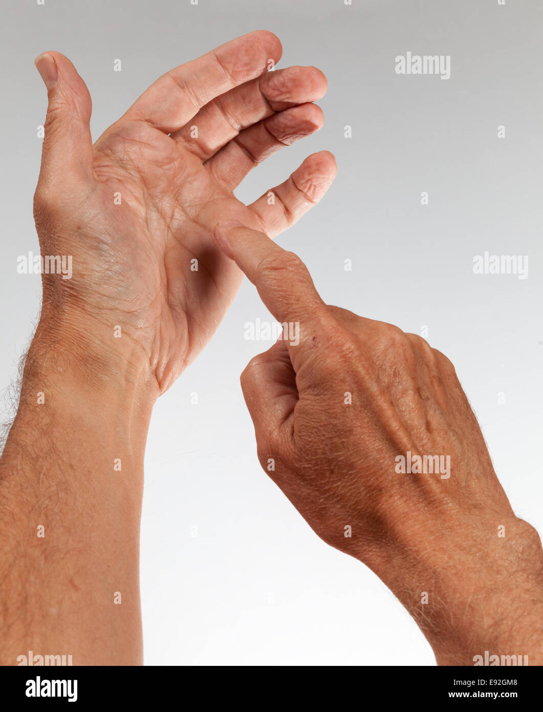 Male hand holding invisible smartphone Stock Photo