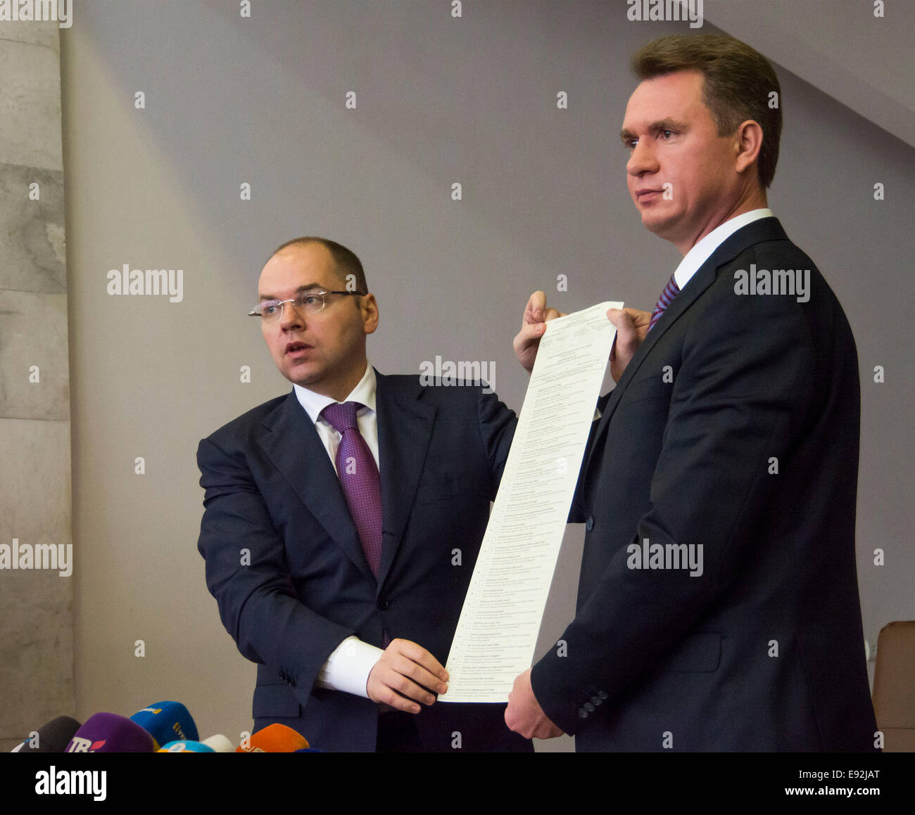 Kiev, Ukraine. 17th October, 2014. Chairman of the Central Election Mykhailo Ohendovsky and director of the State printing plant 'Ukraine' Maxim Stepanov demonstrate new voting ballots. -- Printing of ballots for early parliamentary elections to be held on October 26 will be completed tomorrow,  shipping started today. CEC registered 1189 official observers from foreign states and international organizations on early parliamentary elections. Credit:  Igor Golovnov/Alamy Live News Stock Photo