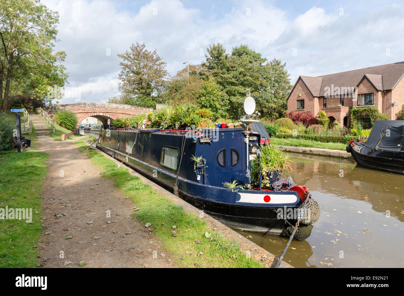 Smart narrow boat with flowers and plants moored on Birmingham and