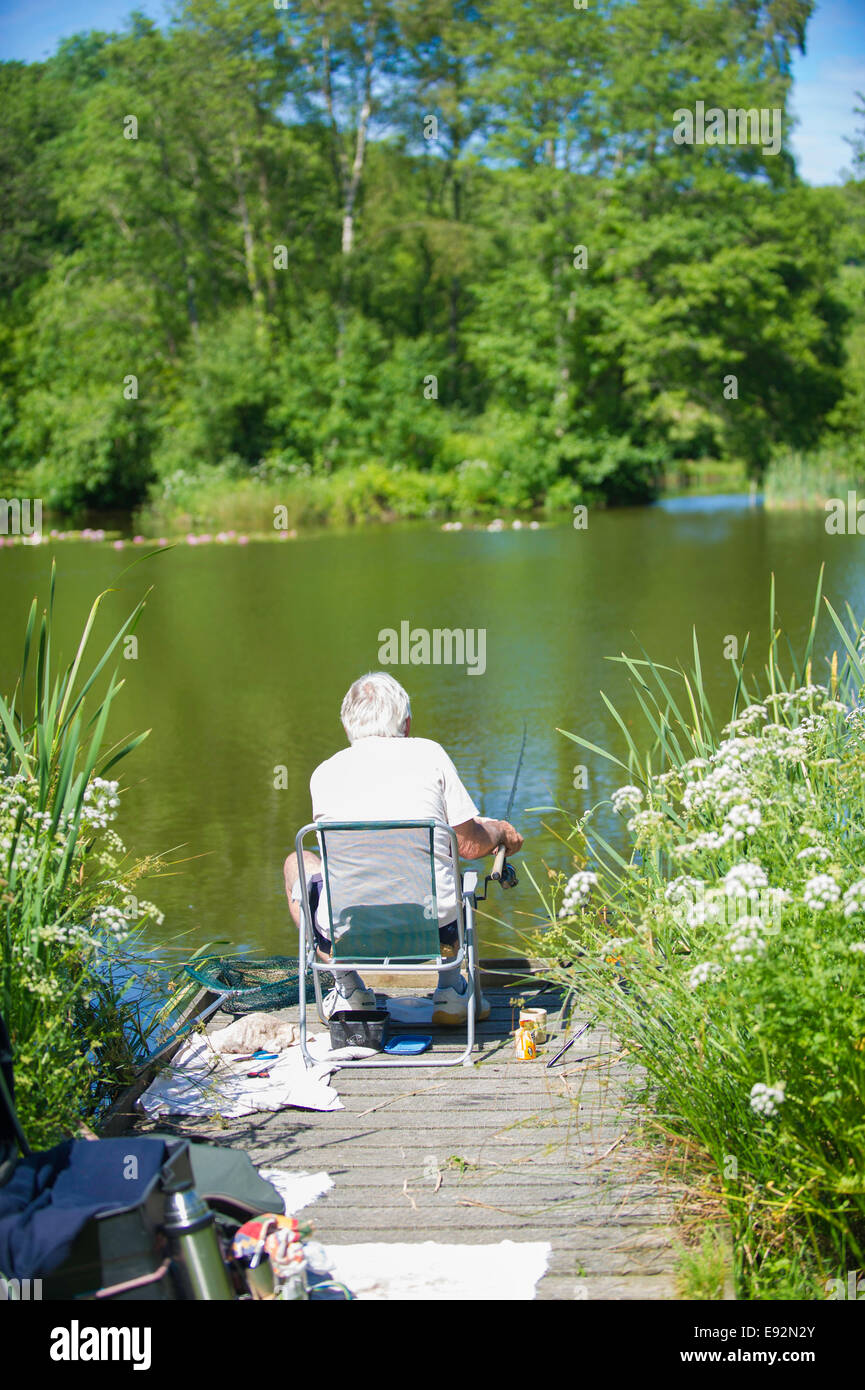 Man coarse fishing on lake Stock Photo