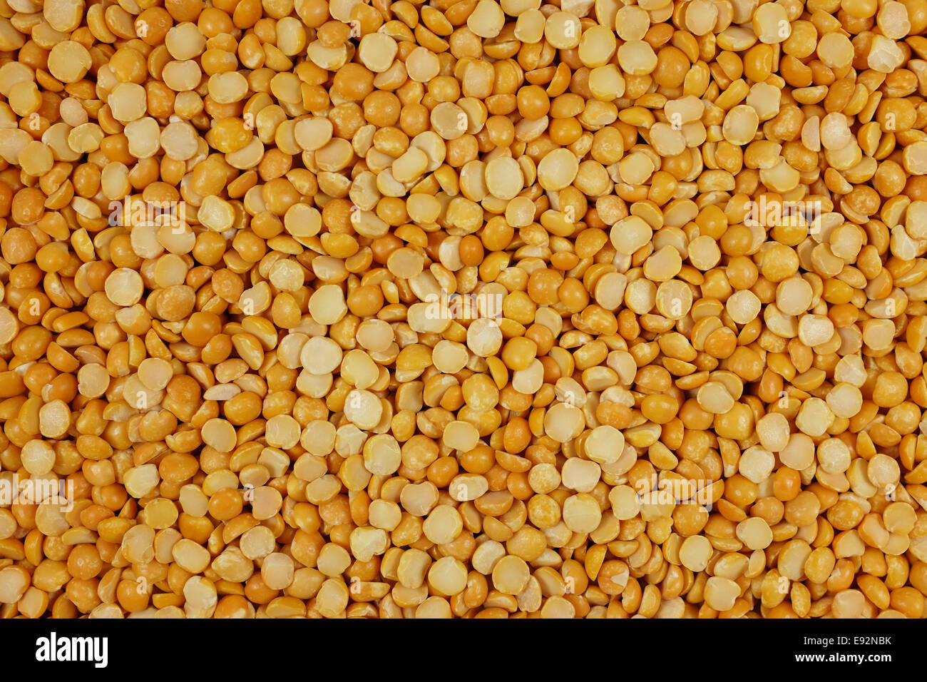 Yellow split peas as an abstract background texture Stock Photo - Alamy