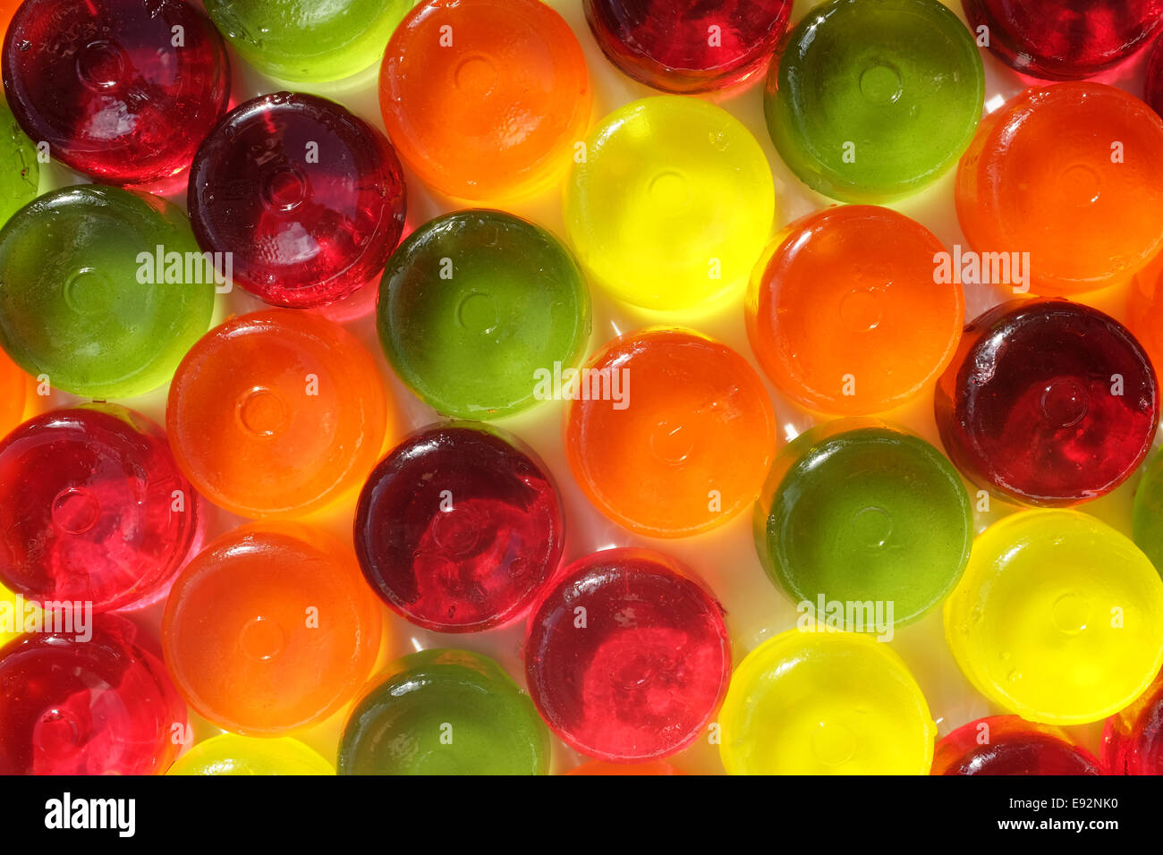 Multi-coloured boiled sweets as an abstract background texture Stock Photo