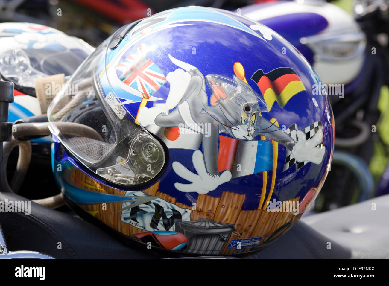 Motorcycle Helmet with Tom and Silvester with world flags on Stock Photo