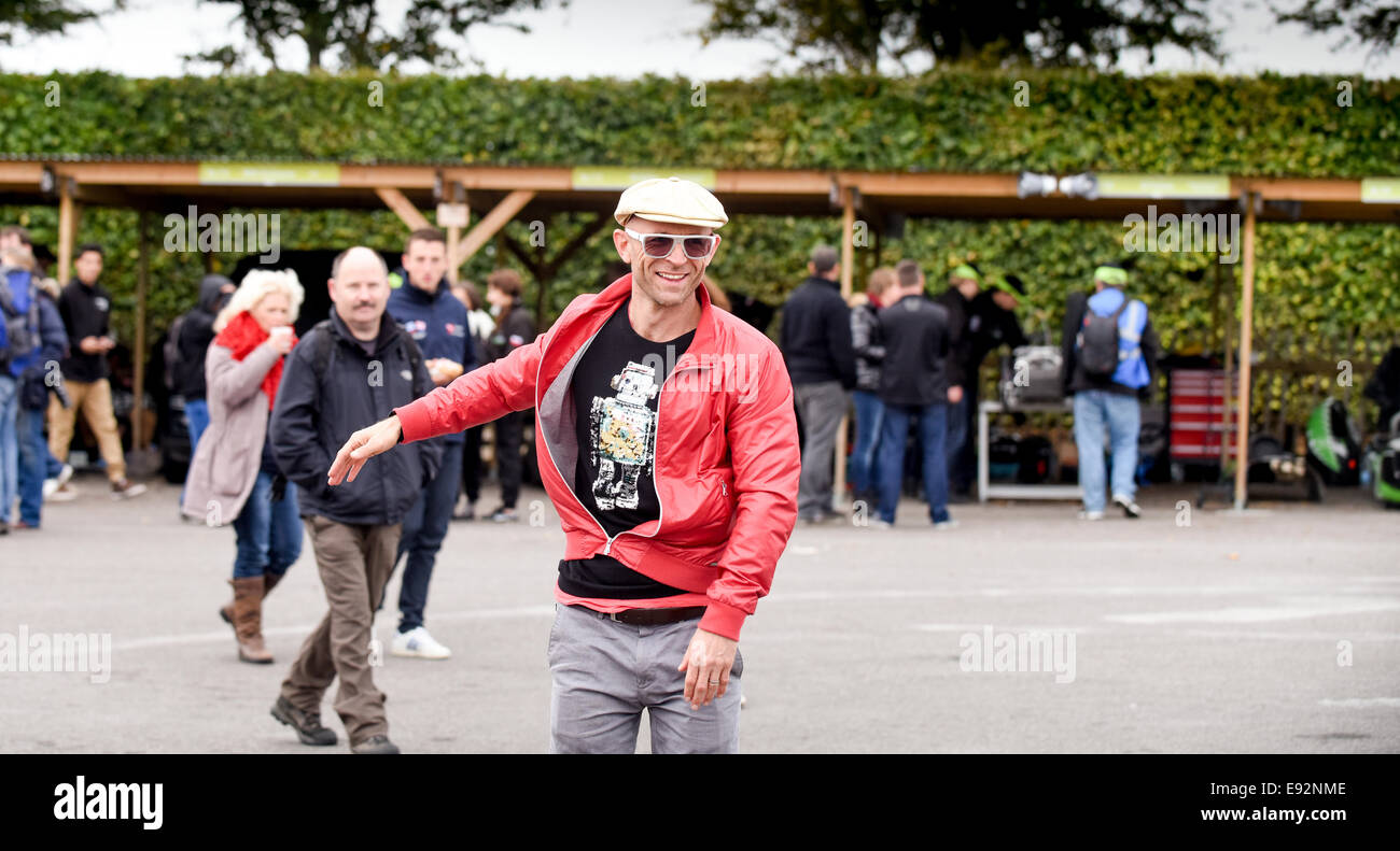 Jason Bradbury presenter of Channel 5 The Gadget Show, spotted at Goodwood Motor Circuit Greenpower event on folding scooter. Stock Photo