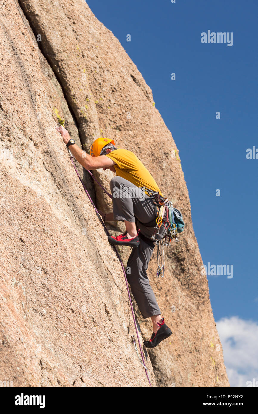 Senior male climber rock climbing on Turtle Rocks near Buena Vista, Colorado, USA Stock Photo