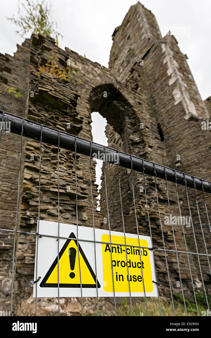 Warning about anti climb paint used on railings at Neath Abbey ruins, Neath, Glanmorgan, Wales, UK Stock Photo