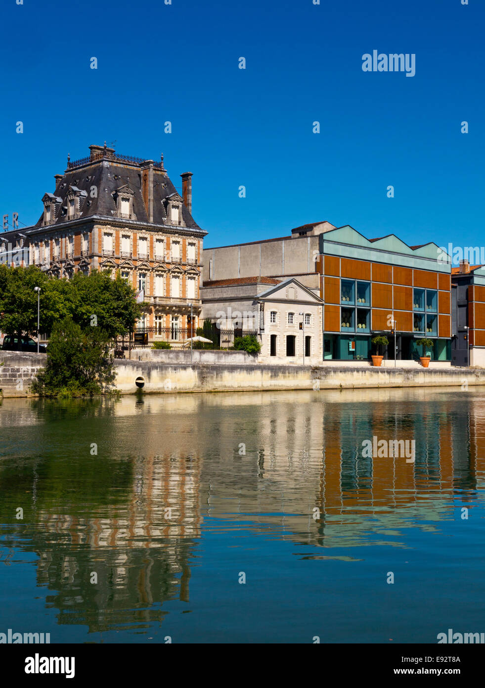 The Courvoisier cognac distillery next to the Charente River in Jarnac the Charente region of south west France Stock Photo