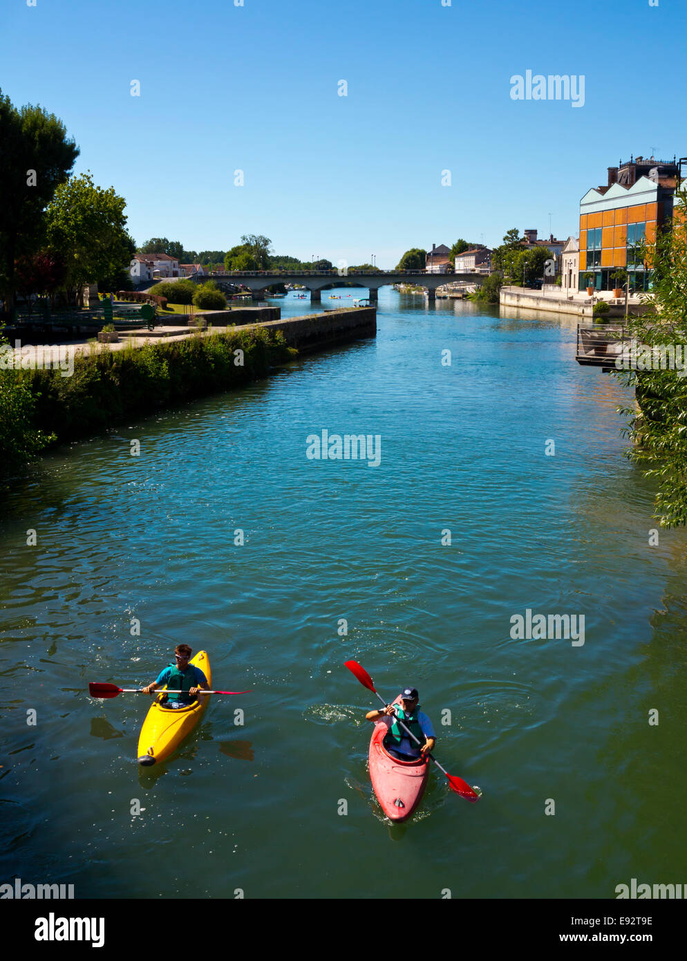 Kayaks on the River Charente flowing through Jarnac in the Charente Region of south west France Stock Photo