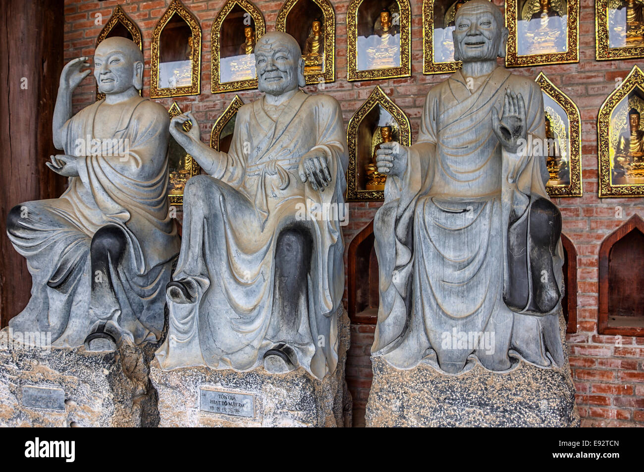 Different facial expressions and postures on Buddhist statues. Stock Photo