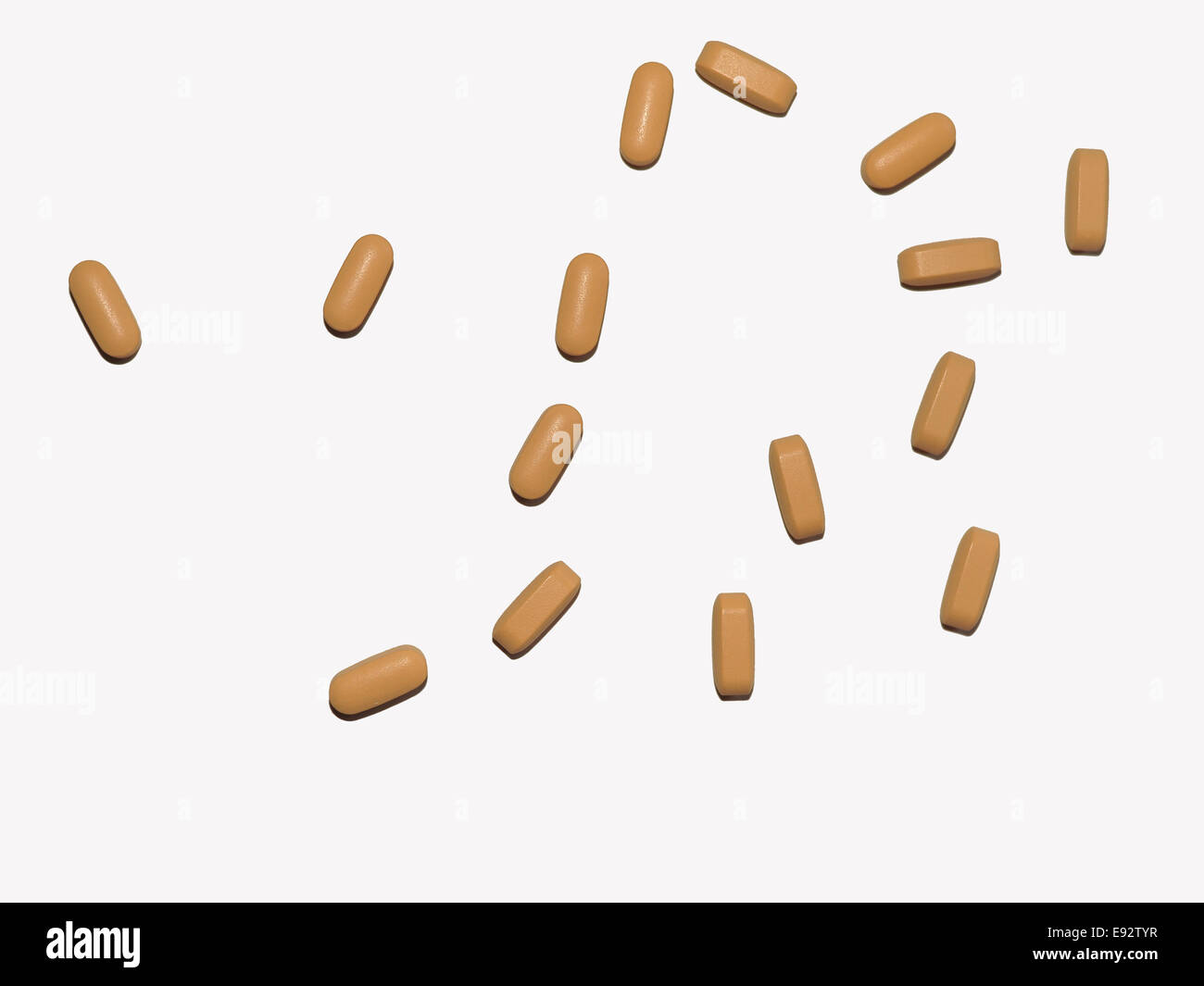 An image of some loose medical tablets against a white background Stock