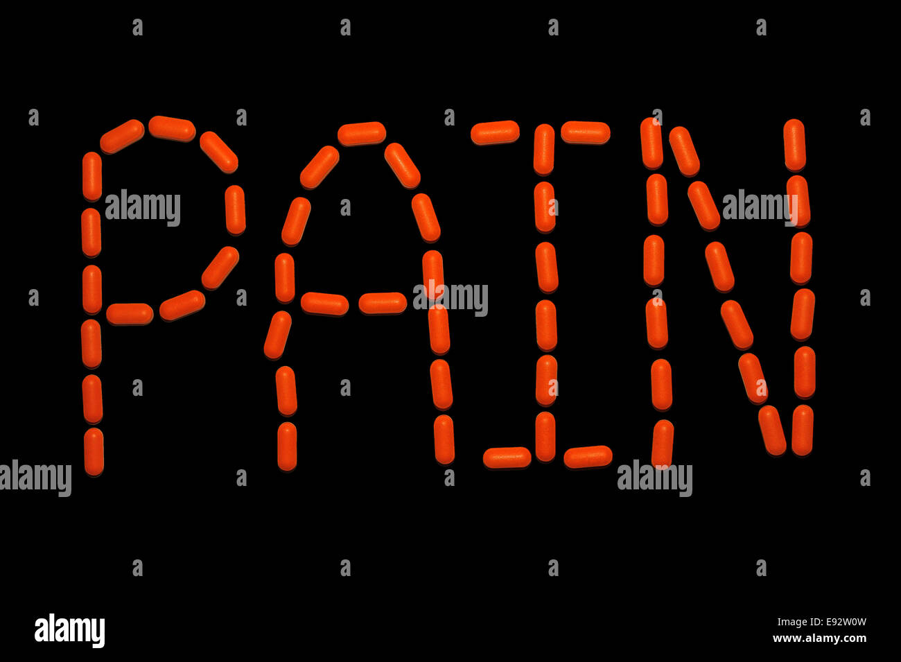 An Image Of The Word Pain Made From Orange Medical Pills Against A Black Background Stock Photo 