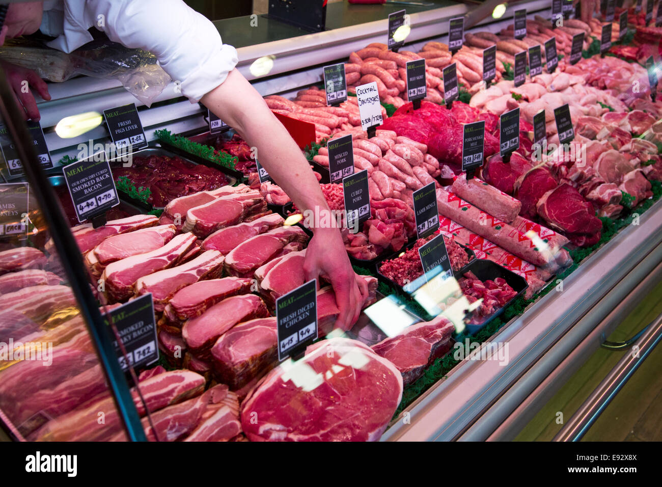 A Meat counter in a butchers shop Stock Photo - Alamy