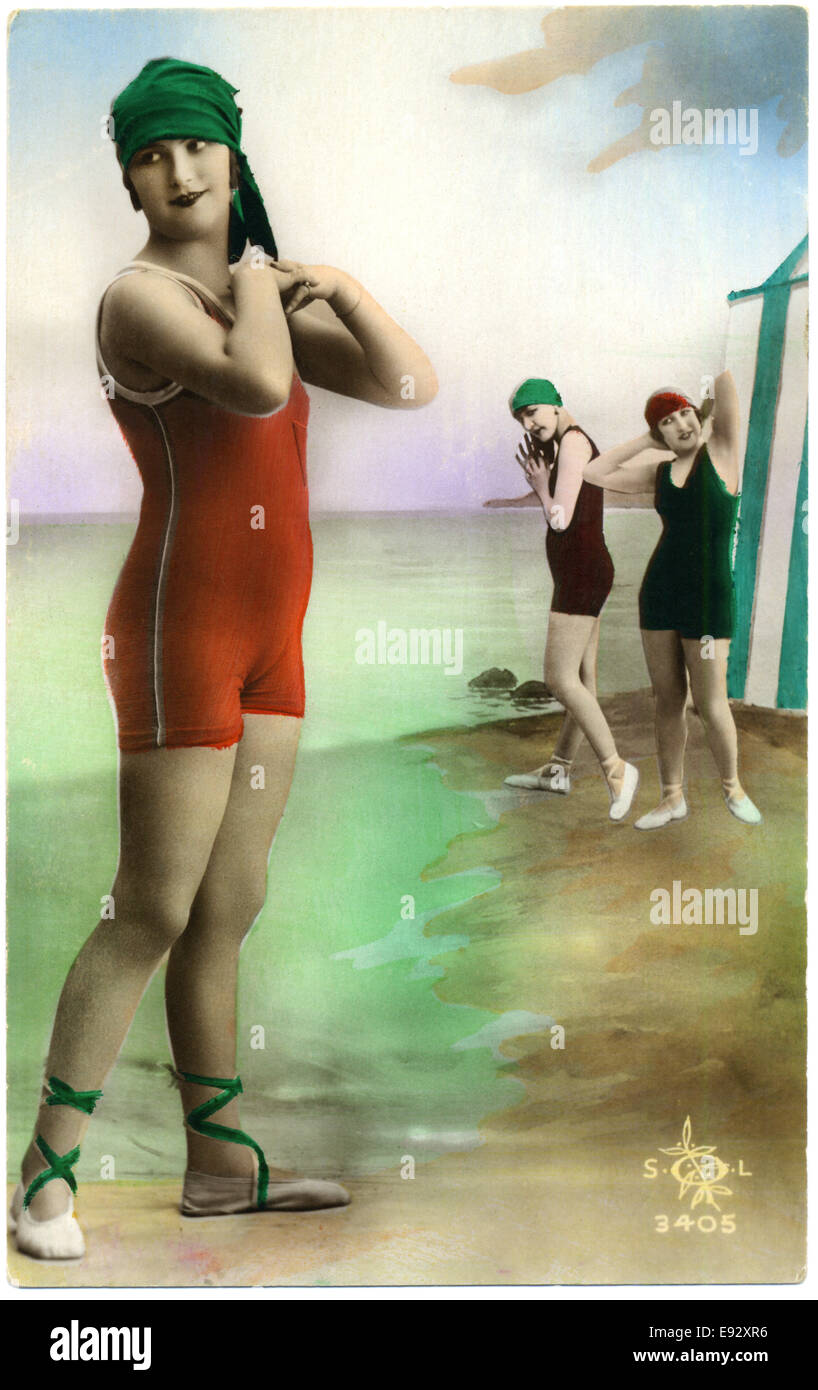Three Fashionable Women in One-Piece Swimsuits, Hand-Colored French Postcard, circa early 1900's Stock Photo