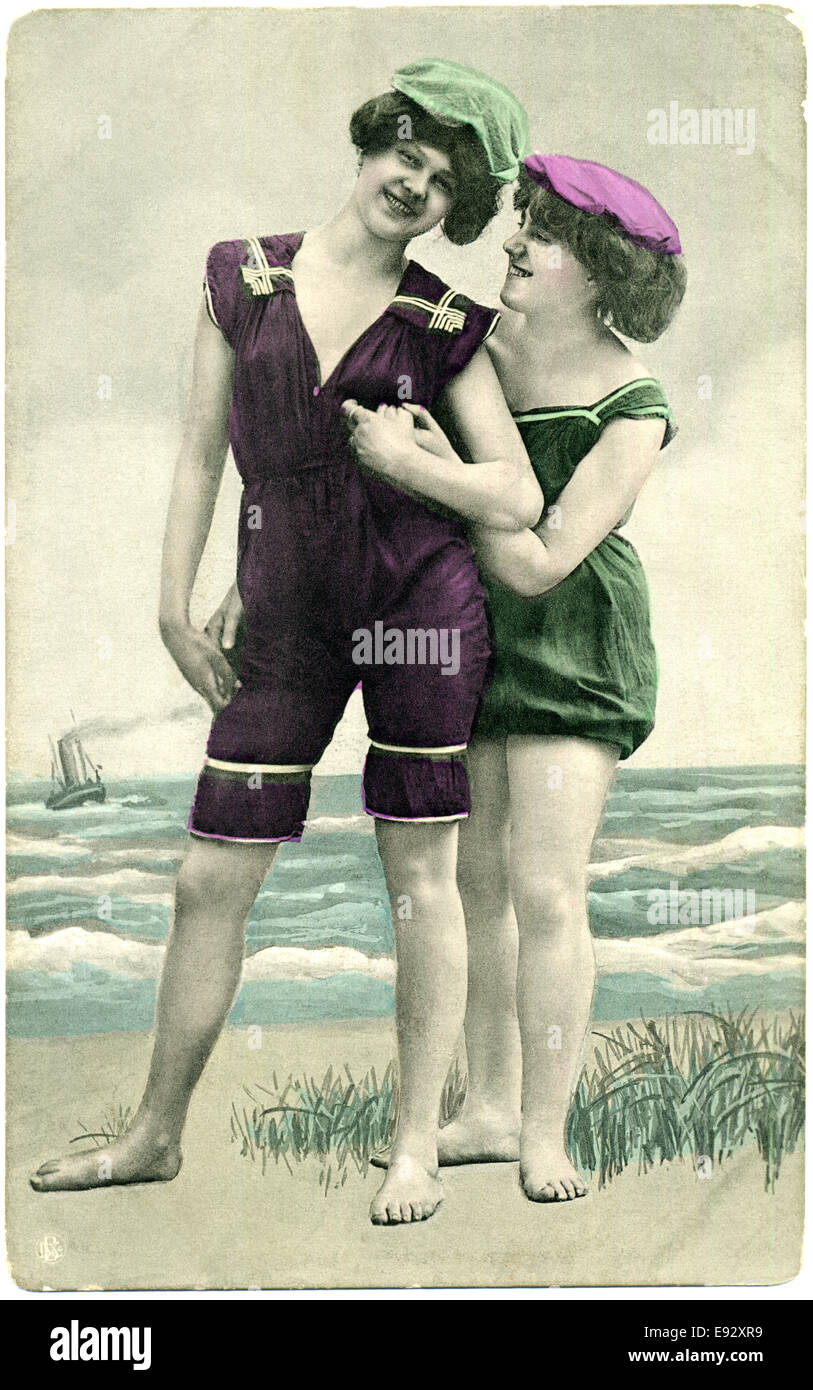 Two Smiling Women in One-Piece Bathing Suits and Caps, Portrait, Postcard,  circa early 1900's Stock Photo - Alamy
