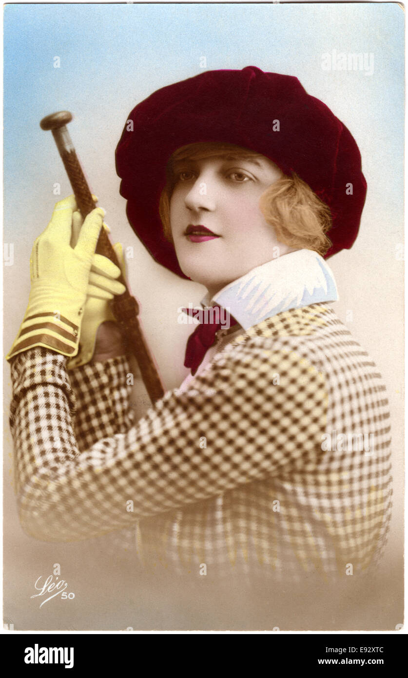 Woman in Checkered Dress and Red Ha Holding Cane, Portrait, Hand-Colored Portrait, circa 1921 Stock Photo
