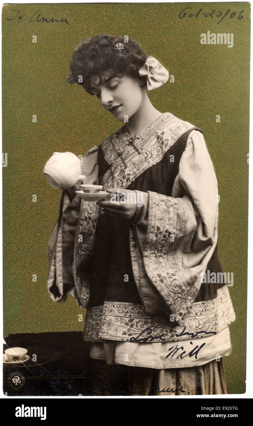 Woman in Kimono Pouring Tea into Teacup, Postcard, circa 1906 Stock Photo