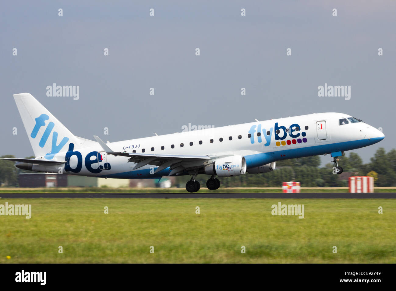 Flybe Embraer ERJ-175 arriving at Schiphol airport. Stock Photo