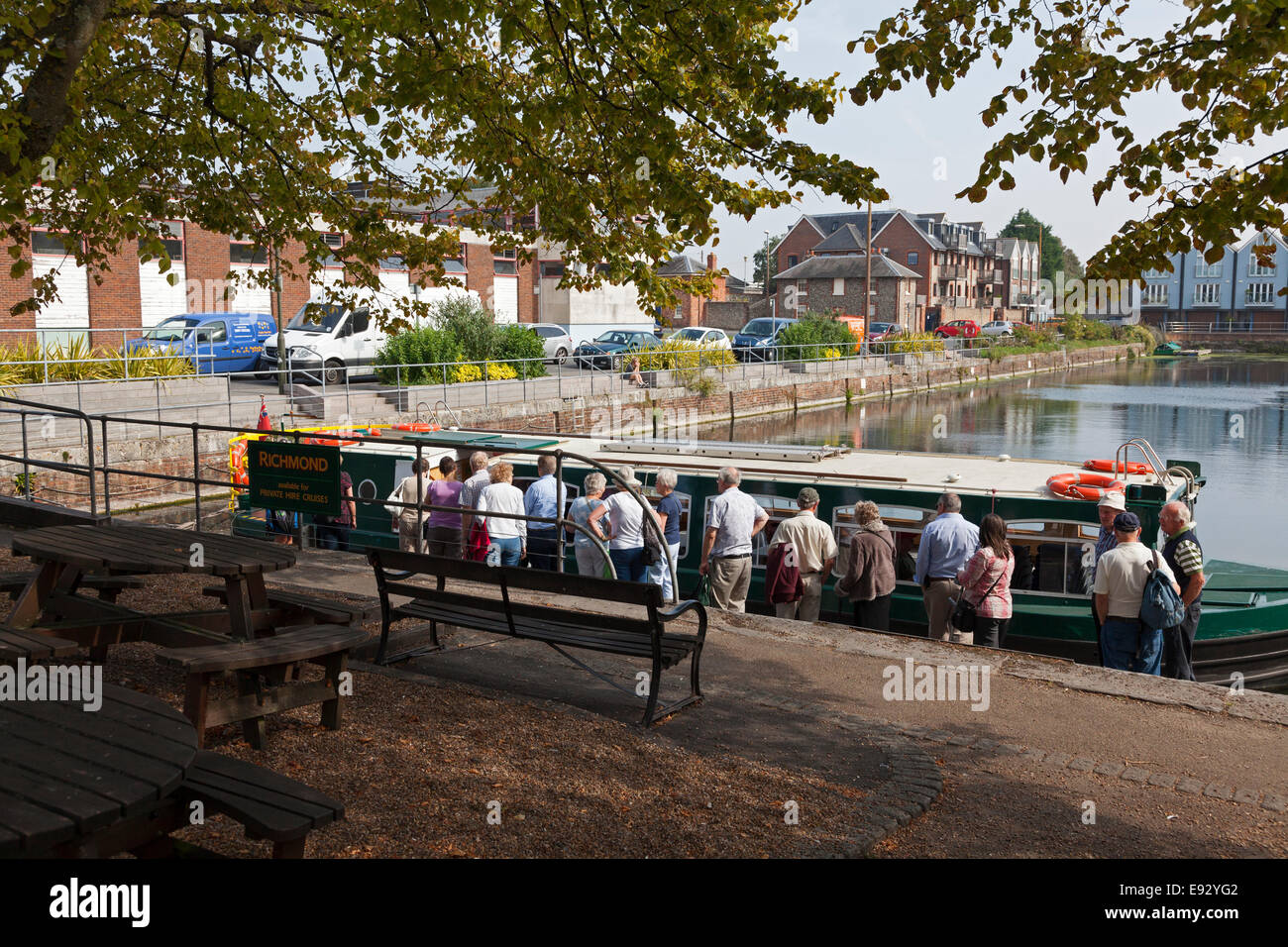 People waiting to board trip boat at Southgate Basin on the Chichester Canal, Chichester, West Sussex Stock Photo