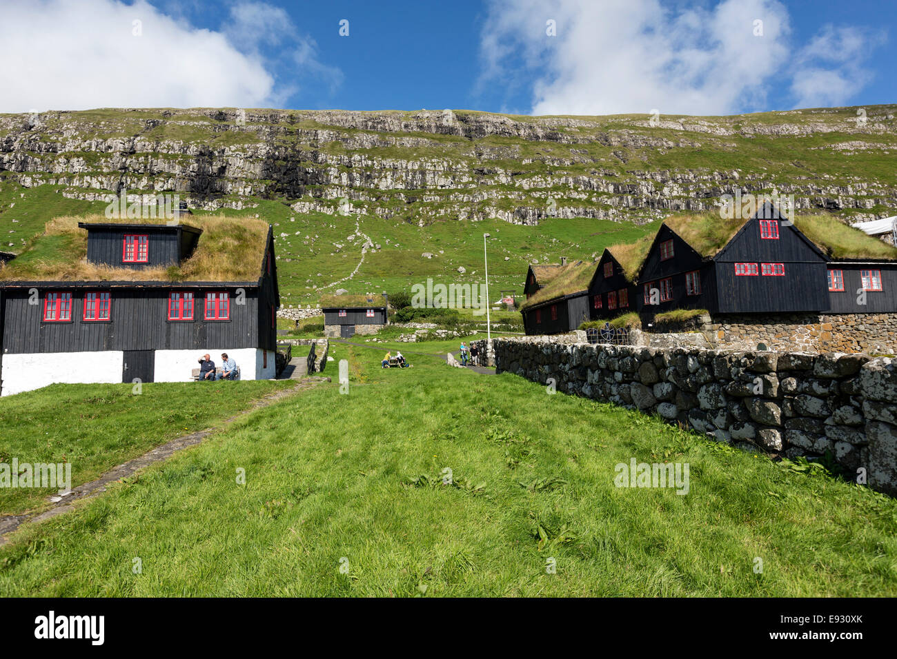 Colorful  wooden houses with roof turf covered  in Kirkjubøur, Streymoy island, Faroe Islands, Stock Photo
