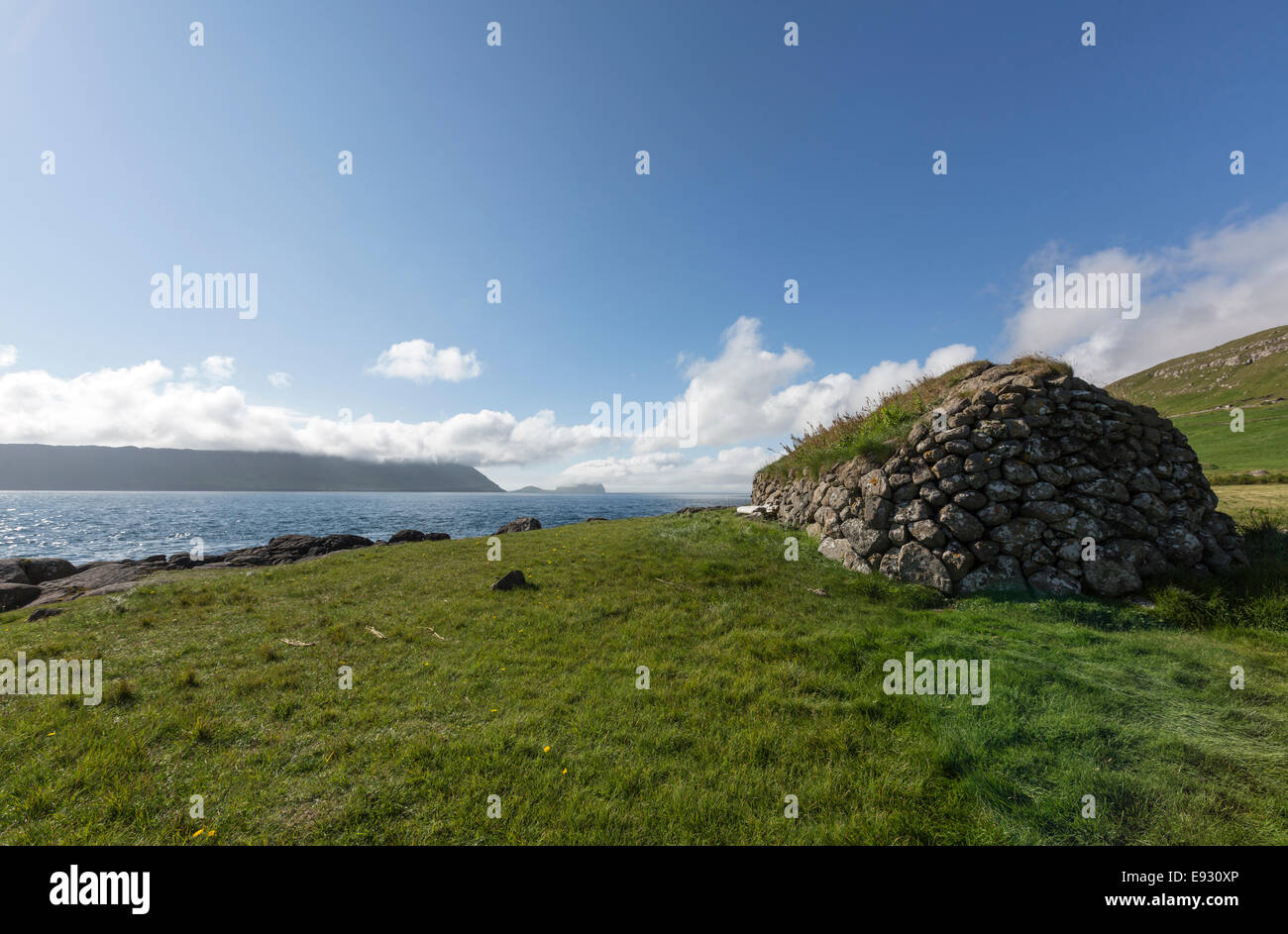 Stone  shelter with  roof  turf covered in Kirkjubøur, Streymoy island, Faroe Islands, Stock Photo