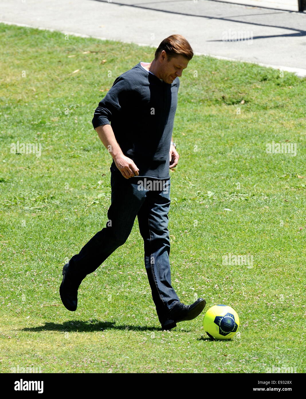 Game of Thrones star Sean Bean playing around with a soccer ball while