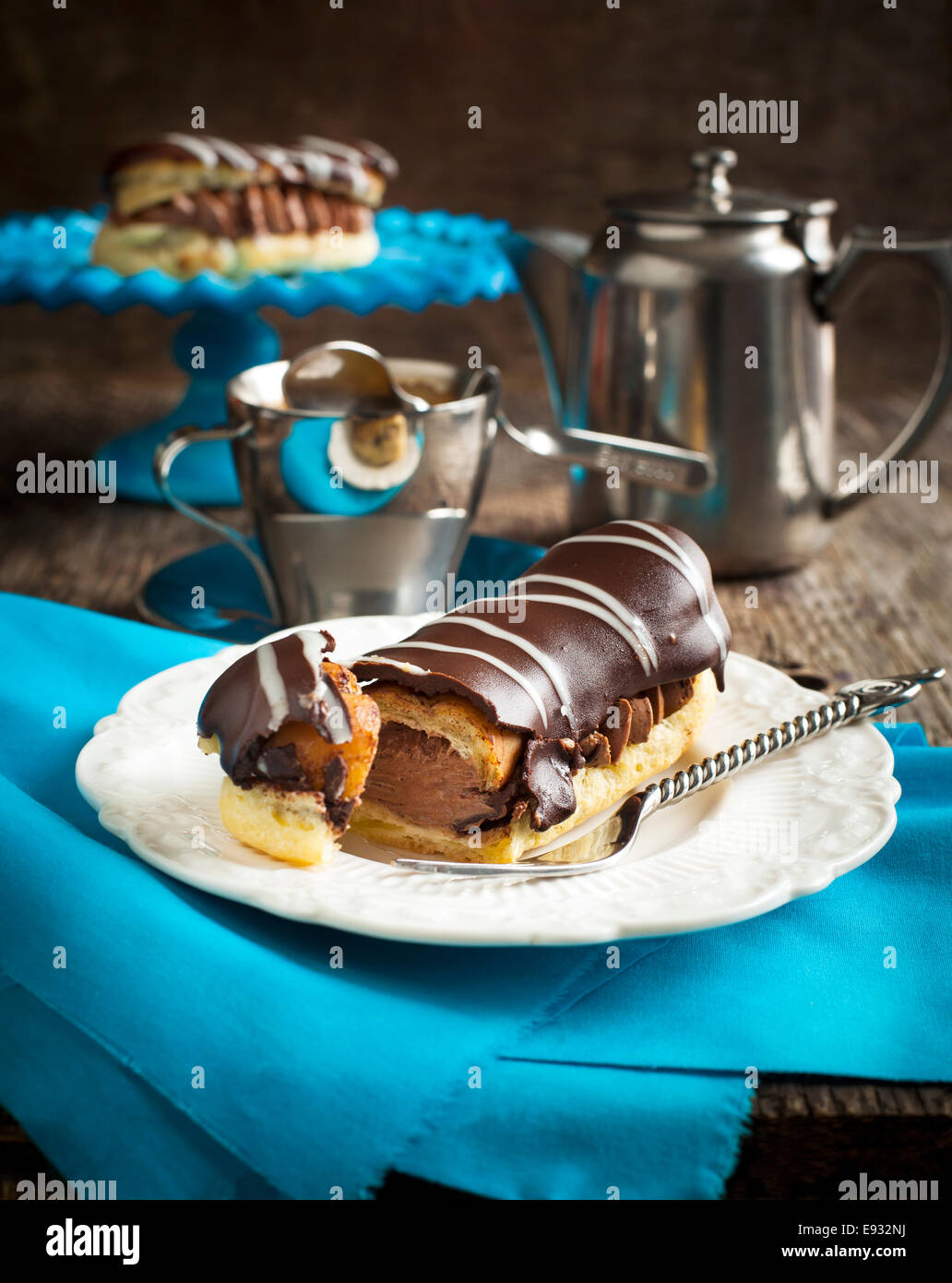Chocolate eclairs and cup of espresso Stock Photo