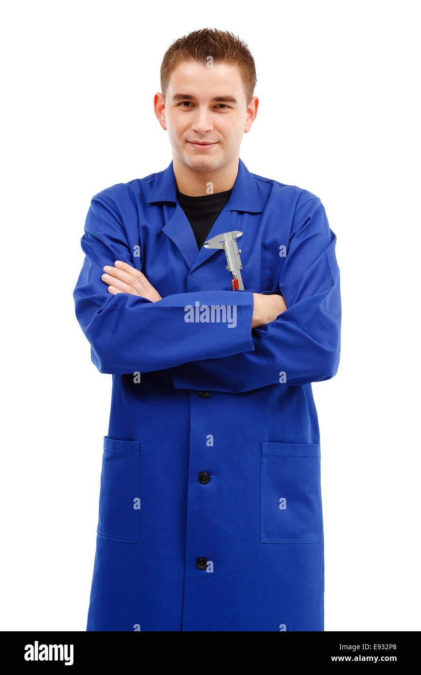 Confident young engineer standing with arms folded and looking. Caliper on his upper pocket Stock Photo