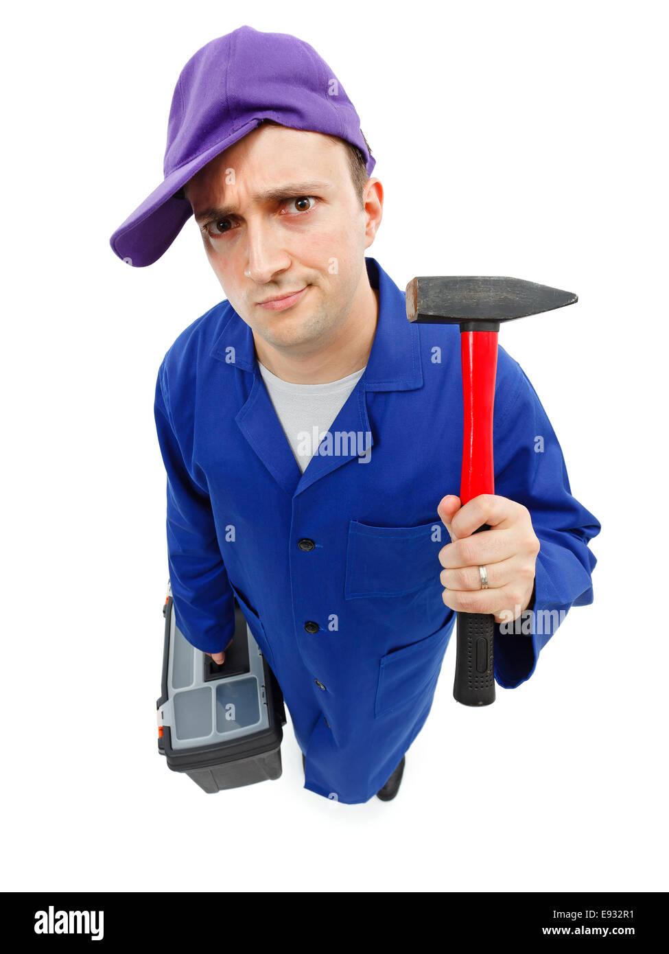 Top view of an awkward repairman with hammer and toolbox Stock Photo