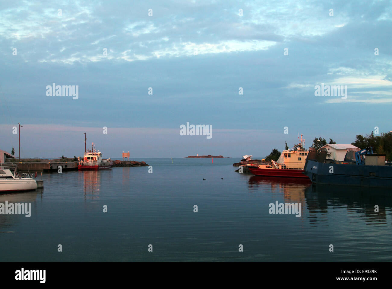 Hanko, Finland: Small boats in bay at sunset Stock Photo