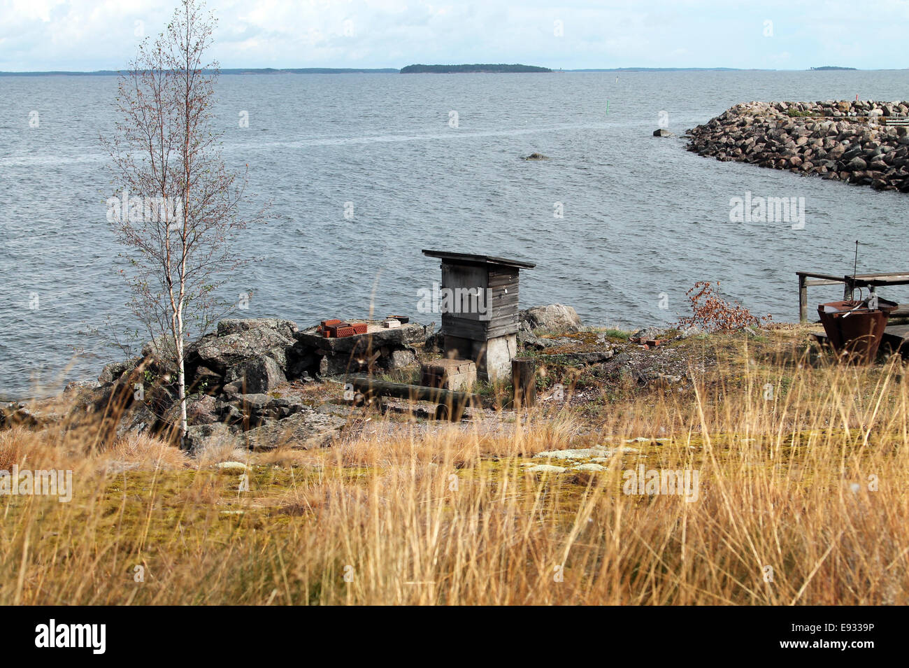 And old Finnish style grill next to ocean Stock Photo