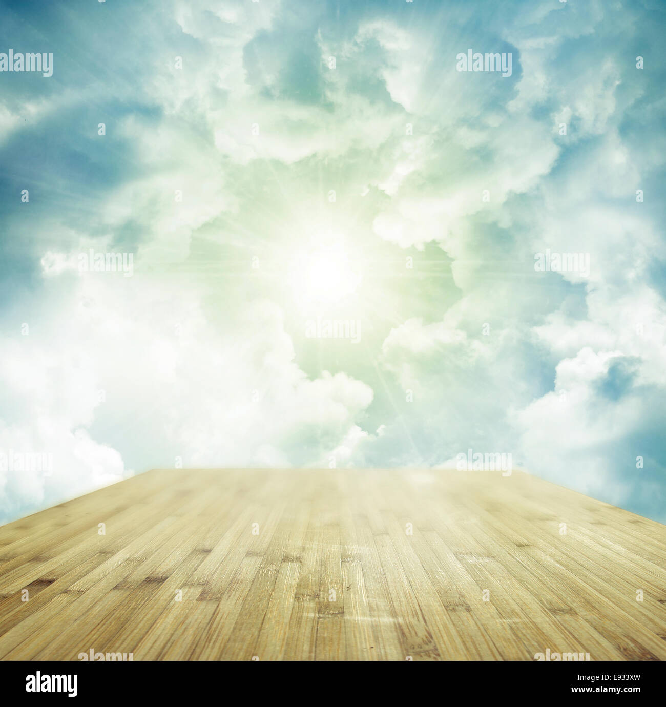 Wooden floor leading to bright sky Stock Photo