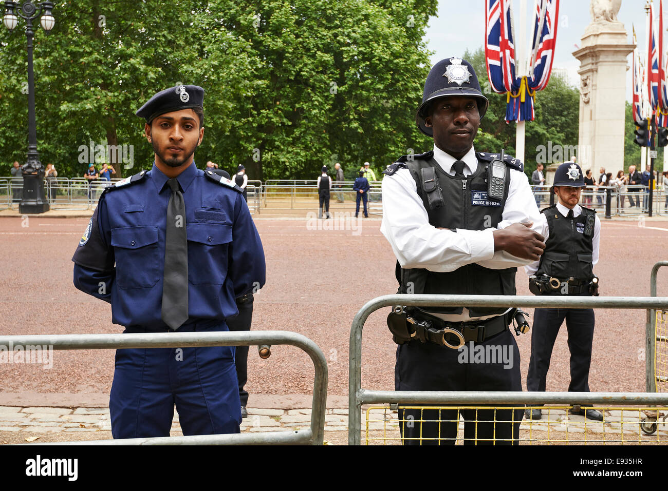 Heavily armed police officers on Guard near Buckingham Palace, London Stock Photo