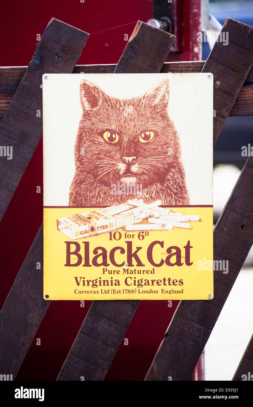 Old cigarette advertisement in train station. Stock Photo