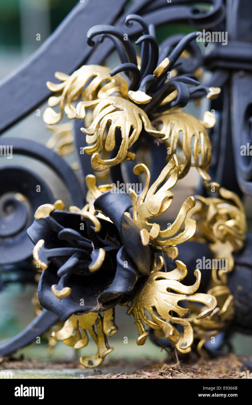 Gold leaf and cast iron decorative gate Stock Photo