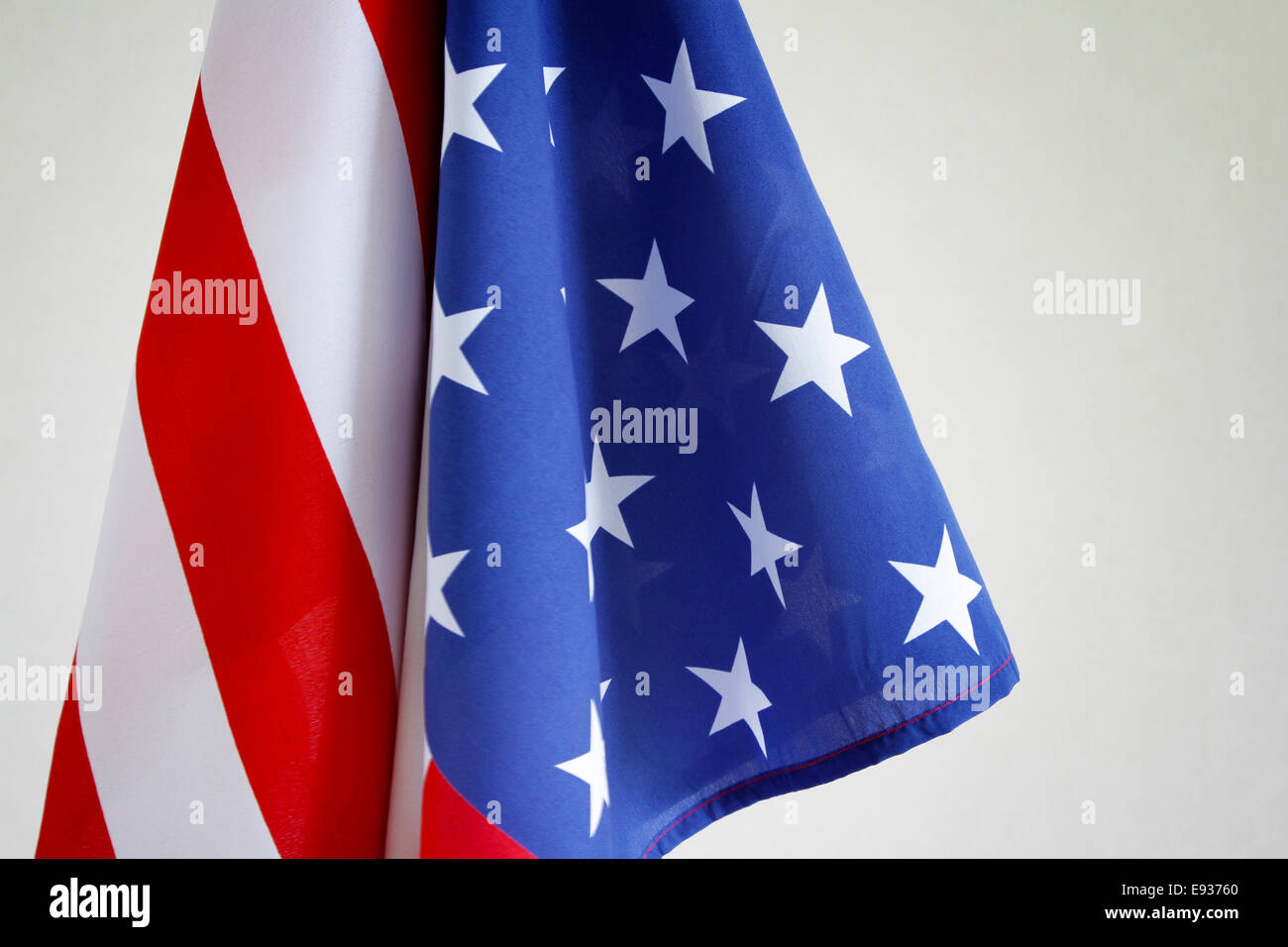 Closeup of American flag in front of gray background Stock Photo