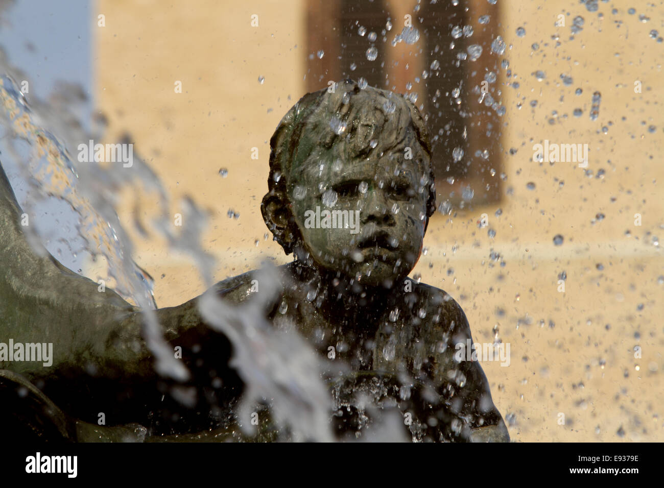 statue waterfall boy face water droplets fountain Stock Photo