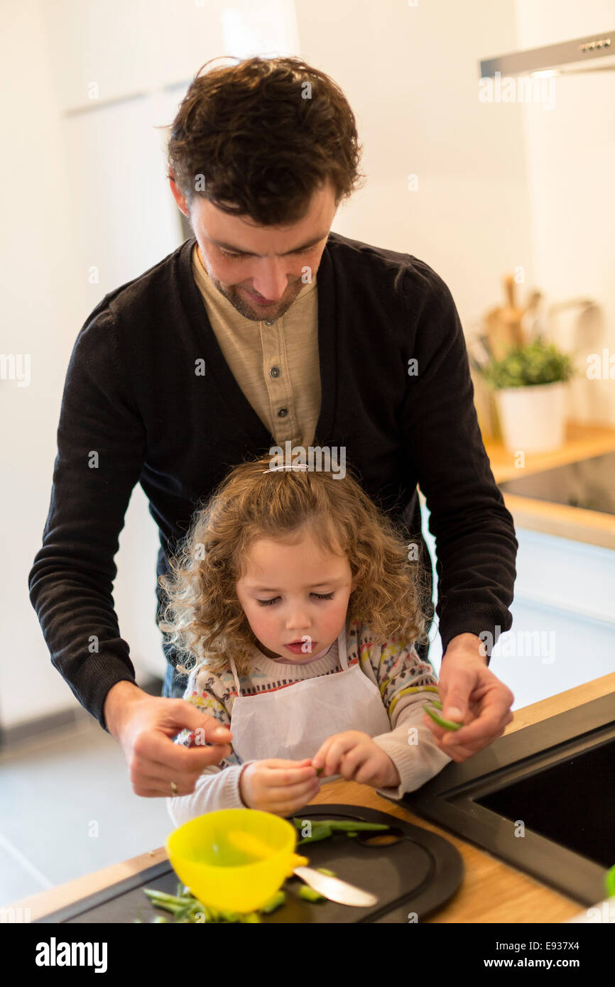 Father and his daughter preparing food Stock Photo