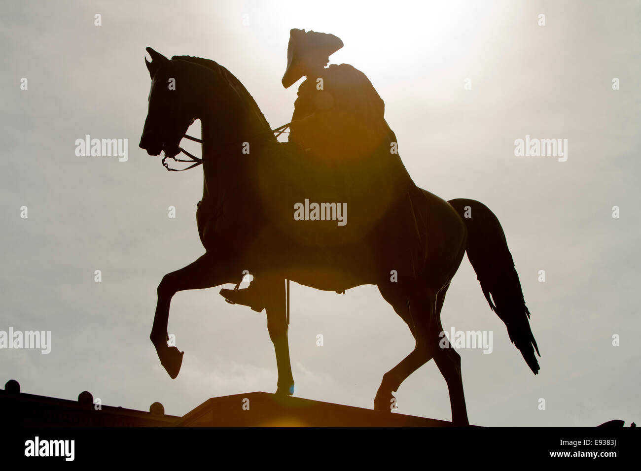 horse and rider statue sun flare silhouette Berlin Stock Photo