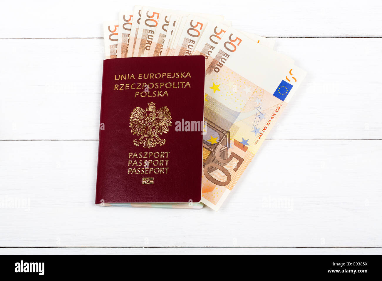 Polish passport with the European currency Stock Photo