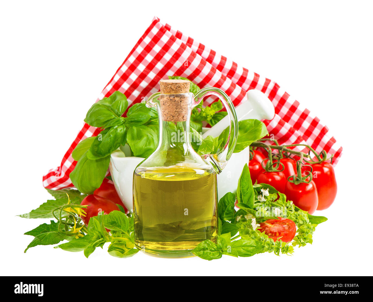 olive oil with fresh basil leaves and tomatoes isolated on white