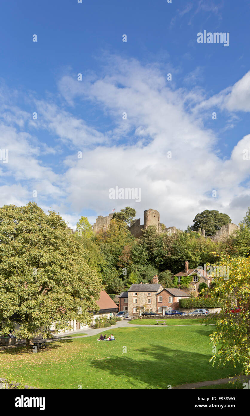 Family having a picnic in Dinham Park with Ludlow Castle, in early autumn color, Ludlow, Shropshire, England, UK Stock Photo